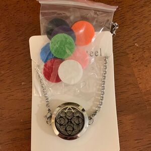 Stainless steel essential oils bracelet/locket with eight pads for your oils.